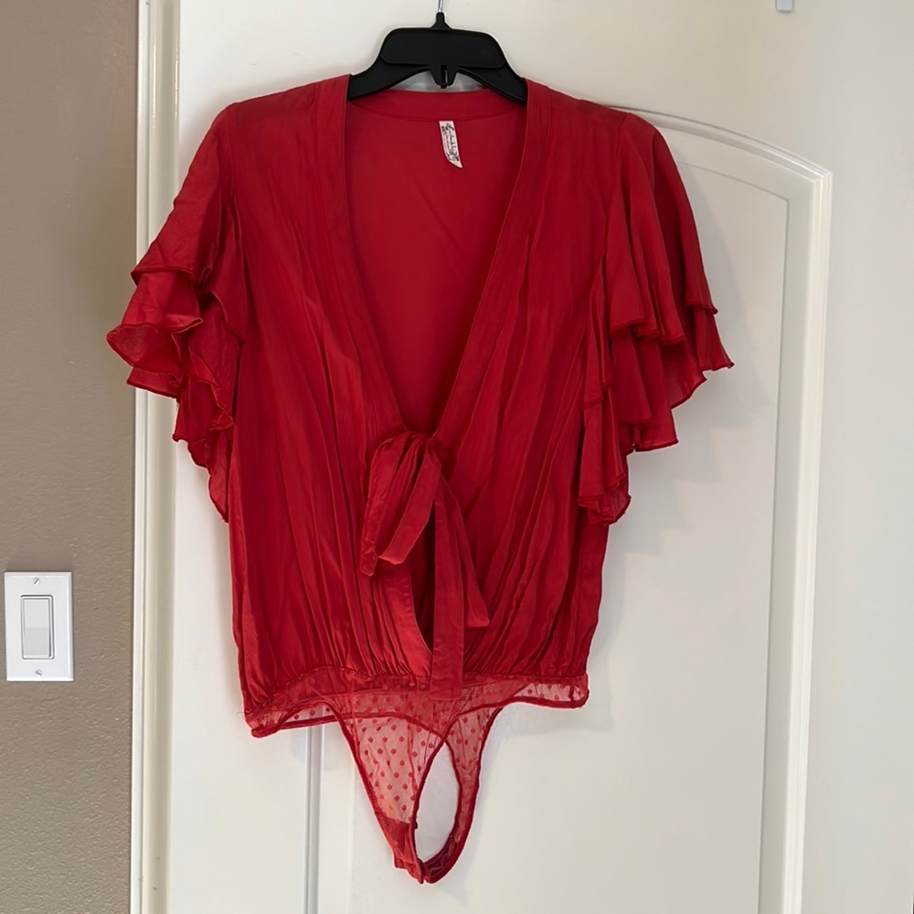 Burnt orange/red free people ruffle shoulder bodysuit.